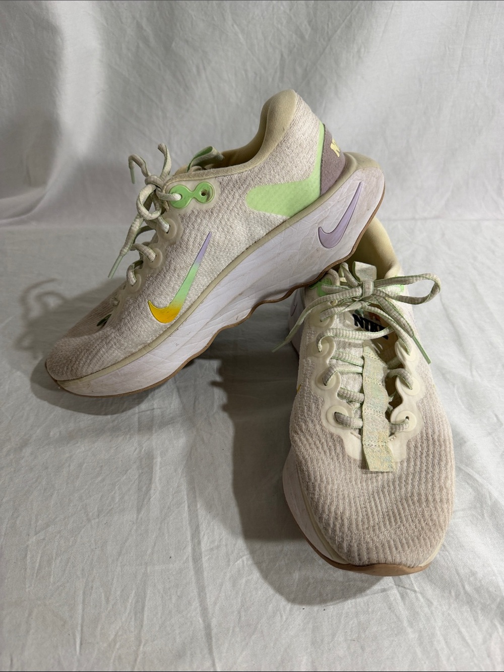 Nike Women's Cream Running Shoes with Pastel Green and Lavender Accents